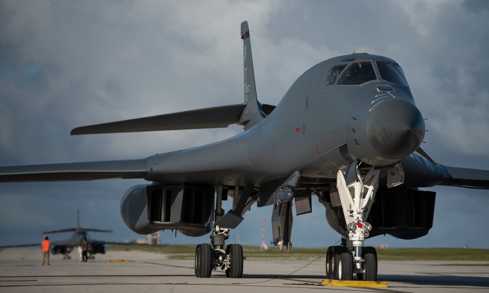 Two 9th Expeditionary Bomb Squadron B-1B Lancers wait to park on the flightline at Andersen Air Force Base, Guam, May 14, 2020. These aircrews had just finished flying a training mission in the East China Sea in support of a Bomber Task Force. BTFs are forms of Dynamic Force Employments, which deploy pockets of airpower around the globe with unpredictability. (U.S. Air Force photo by Senior Airman River Bruce)