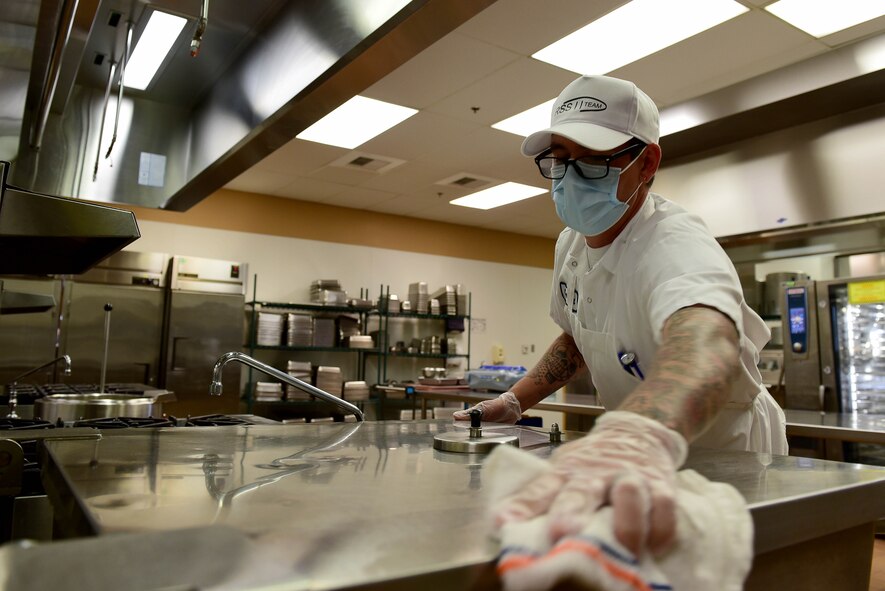 Cameron Crow, Guardian Dining Facility (DFAC) cook, wipes down a kitchen surface at Creech Air Force Base, Nevada, April 17, 2020.