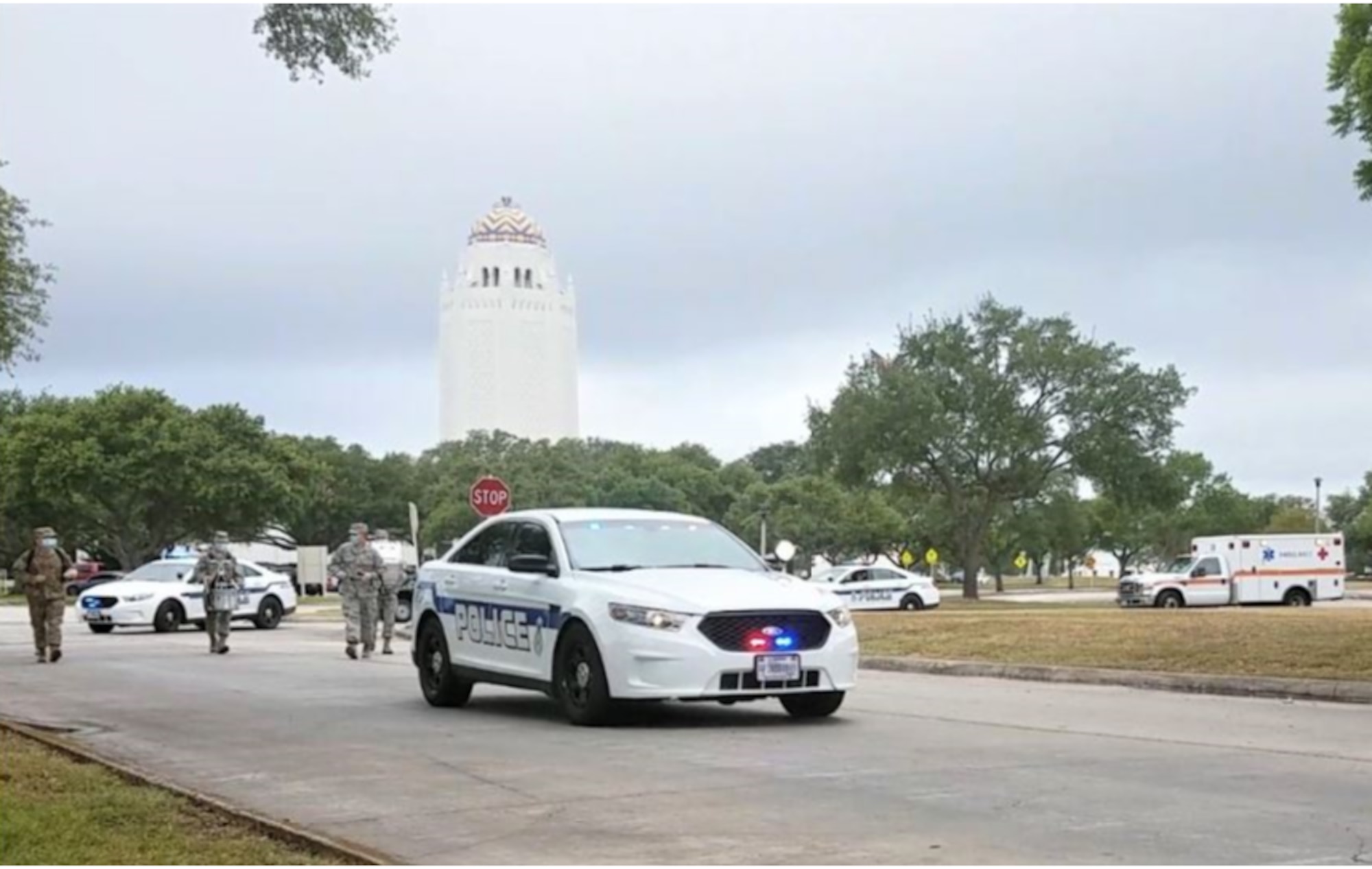 The lead vehicle of the procession during the National Police Week parade drives down C Street at Joint Base San Antonio-Randolph, Texas, May 13, 2020. Due to COVID-19 and social distancing, the 902nd Security Forces Squadron invited other first responders to join them in parading through base housing so the community could show their appreciation.