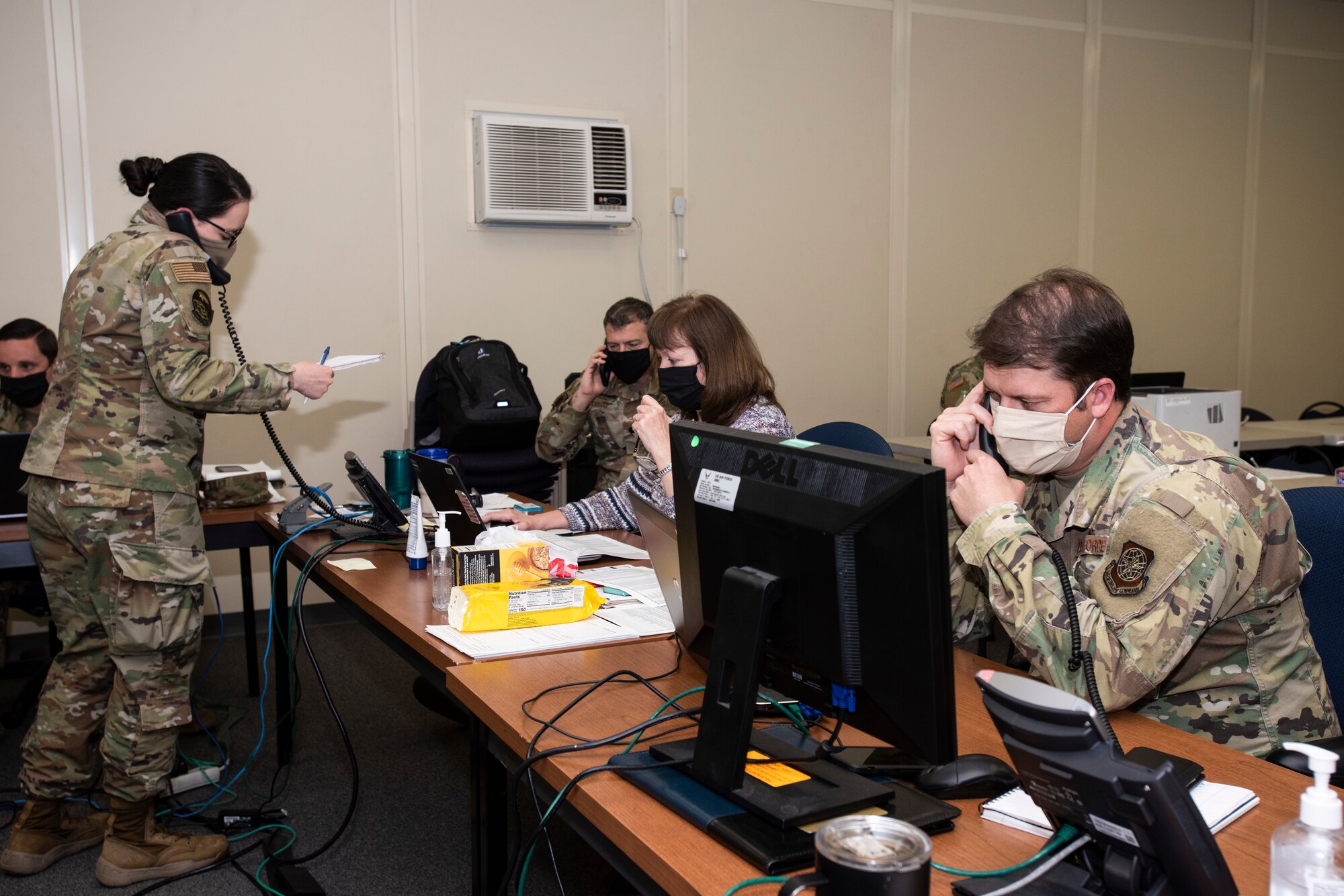 Photos of individuals at a desk answer phone calls.