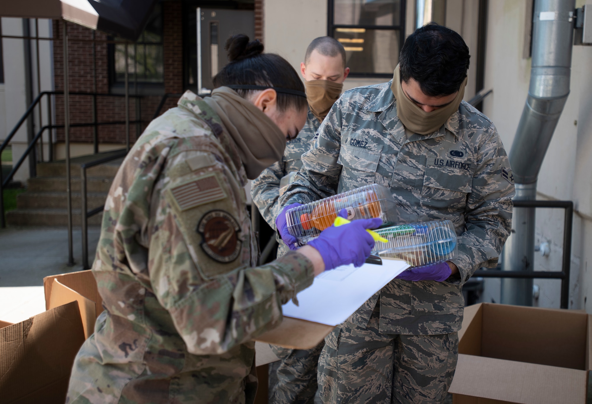 Photo of service members documenting meals.