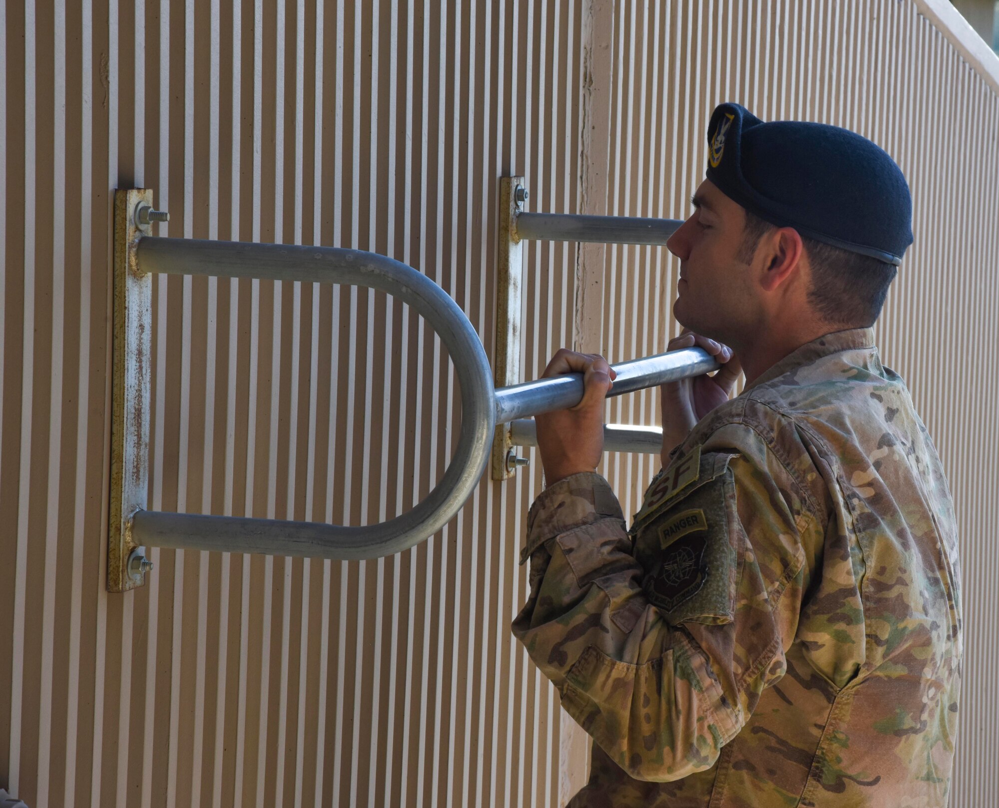 U.S. Air Force Staff Sgt. Joseph Pace, 92nd Security Forces Squadron installation patrolman, performs a chin up at Fairchild Air Force Base, Washington, May 8, 2020. Pace completed Ranger school as one the 300 Airmen to do so. (U.S. Air Force photo by Airman 1st Class Anneliese Kaiser)