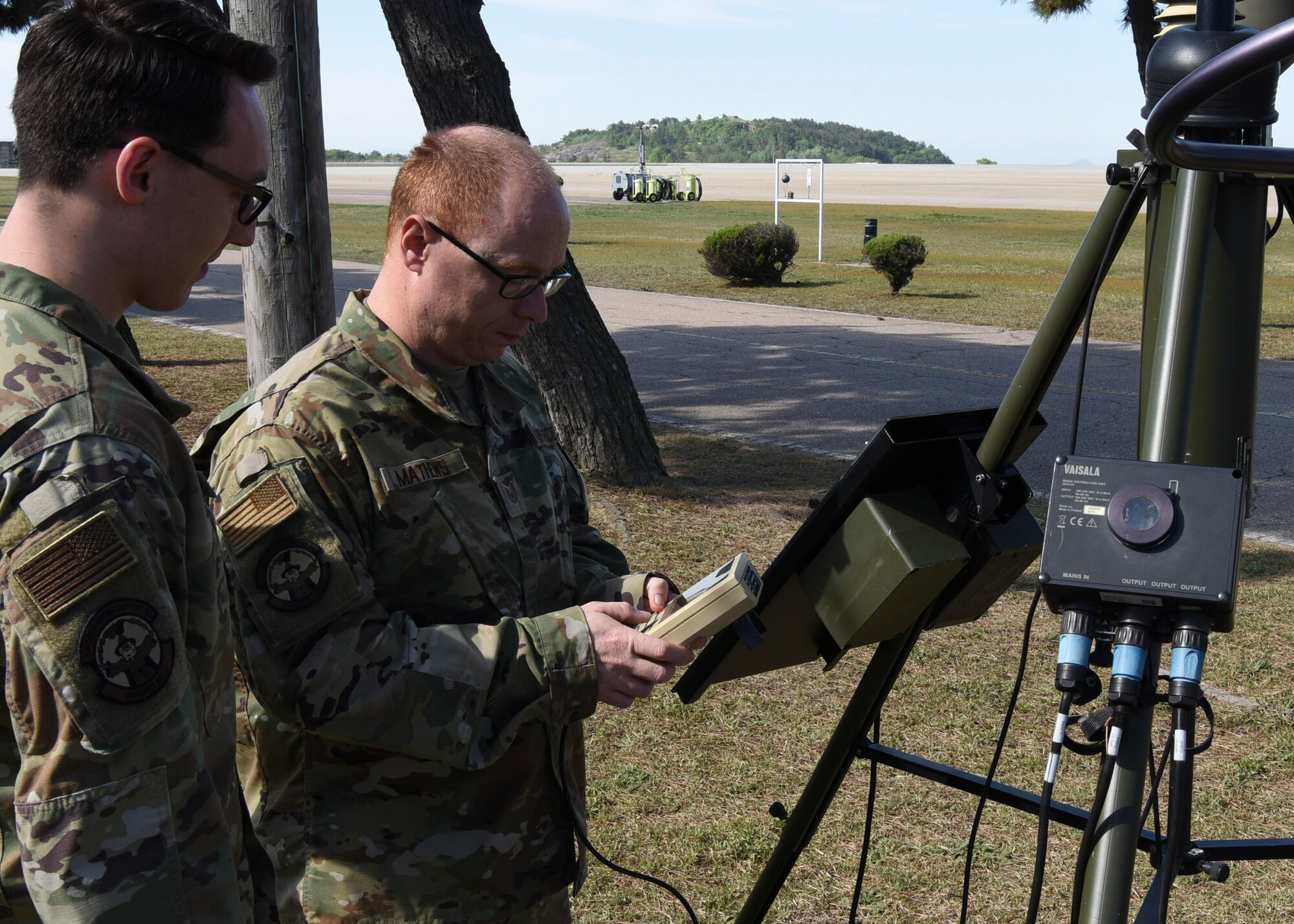 U.S. Air Force Tech. Sgt. Phillip Mathews, 8th Operations Support Squadron weather operations NCO in charge, ensures the TMQ-53 is providing weather data at Kunsan Air Base, Republic of Korea, May 8, 2020. The TMQ-53 is a portable, automated weather station used to set up in austere locations to attain weather data from the area. Weather flight Airmen at Kunsan train with the equipment quarterly to ensure the capability is mission-ready if called upon. (U.S. Air Force photo by Staff Sgt. Anthony Hetlage)