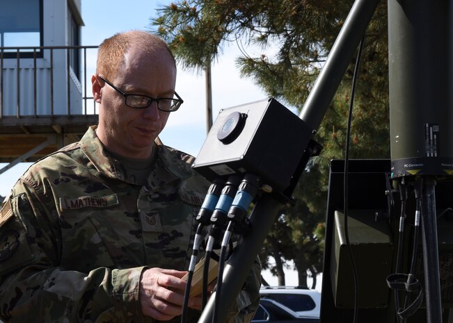 U.S. Air Force Tech. Sgt. Phillip Mathews, 8th Operations Support Squadron weather operations NCO in charge, ensures the TMQ-53 is providing weather data at Kunsan Air Base, Republic of Korea, May 8, 2020. The TMQ-53 is a portable, automated weather station used to set up in austere locations to attain weather data from the area. The equipment takes roughly 30 minutes for a two-member team to set up and 45 minutes for a lone member. (U.S. Air Force photo by Staff Sgt. Anthony Hetlage)