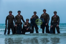 Cpl. Michael Cenci (middle left), a force reconnaissance Marine with the 31st Marine Expeditionary Unit's Maritime Raid Force and a native of Malvern, Pennsylvania, holds a Reconnaissance Foundation flag at Hat Yao, Kingdom of Thailand, March 5, 2020, following the completion of Exercise Cobra Gold 2020. Cobra Gold 20 was the largest theater security cooperation exercise in the Indo-Pacific region and an integral part of the U.S. commitment to strengthen engagement in the region. (U.S. Marine Corps photo by Cpl. Isaac Cantrell)