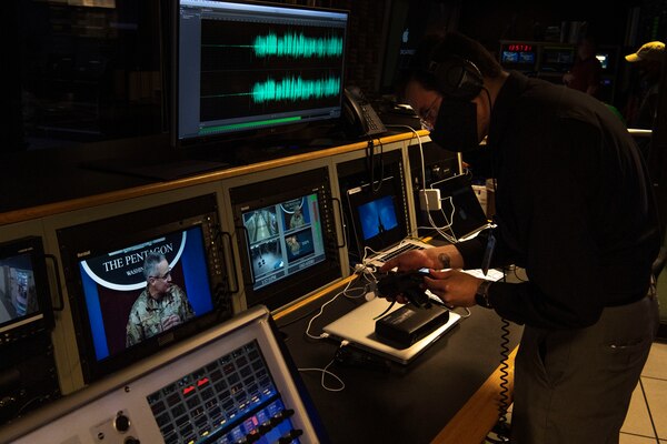 Technician manages video board.