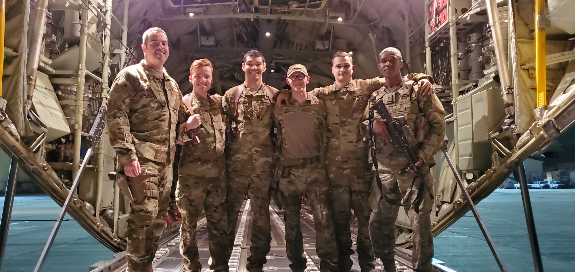 An aircrew assigned to the 774th Expeditionary Airlift Squadron poses for a group photo in Afghanistan, Sept. 2019.