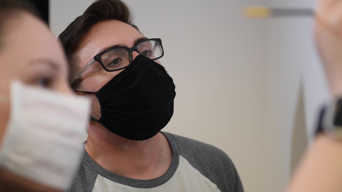 U.S. Air Force Senior Airman Tyler Menz, 39th Security Forces Squadron unit training instructor, watches as Airman 1st Class Anna Whittington, 39th SFS commander’s support staff, paints a mural in a dormitory building April 23, 2020, at Incirlik Air Base, Turkey. Murals are a common feature in Air Force dormitories, often depicting various aspects of military heritage. (U.S. Air Force photo by Staff Sgt. Joshua Magbanua)