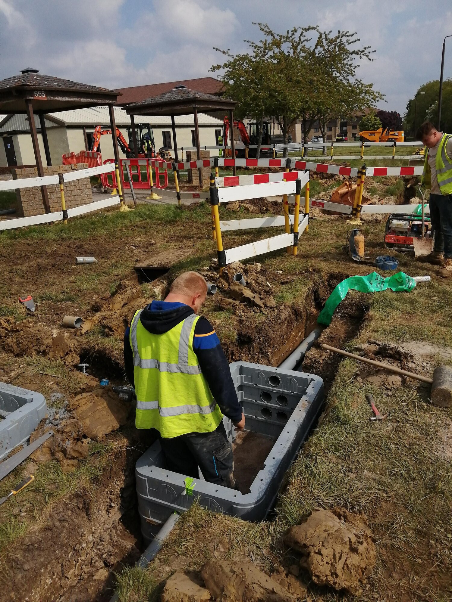 Contractors install new communication lines at RAF Fairford, England, May 4, 2020. Run by the 501st Combat Support Wing Plans and Programs Office, the project aims to recapitalize information technology infrastructure around the base, ensuring its networks are resilient and reliable for an expanding mission set (Courtesy photo)