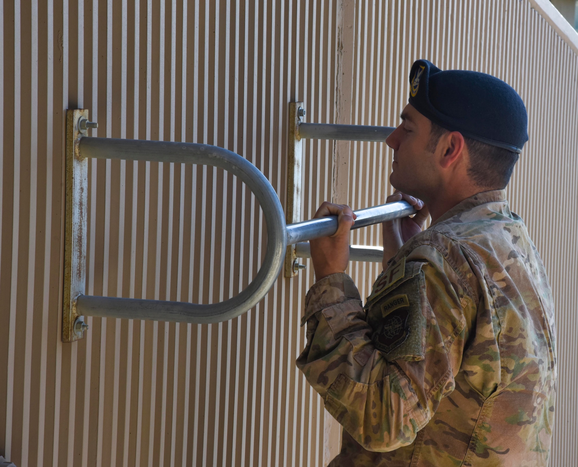 U.S. Air Force Staff Sgt. Joseph Pace, 92nd Security Forces Squadron installation patrolman, performs a chin up at Fairchild Air Force Base, Washington, May 8, 2020. Pace completed Ranger school as one the 300 Airmen to do so. (U.S. Air Force photo by Airman 1st Class Anneliese Kaiser)