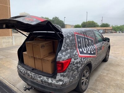 A United Service Organizations San Antonio is parked while making deliveries to Joint Base San Antonio-Fort Sam Houston and Lackland Air Force Base, Texas, April 17, 2020. This week deliveries have occurred daily to those in quarantine, those continuing the training pipeline while observing social distancing regulations, and the ERPSS (En Route Patient Staging System Team) for the Wounded Warriors. This week's deliveries served over 18,000 with grab and go snacks, meal to go boxes, hygiene products, and other essential items.
