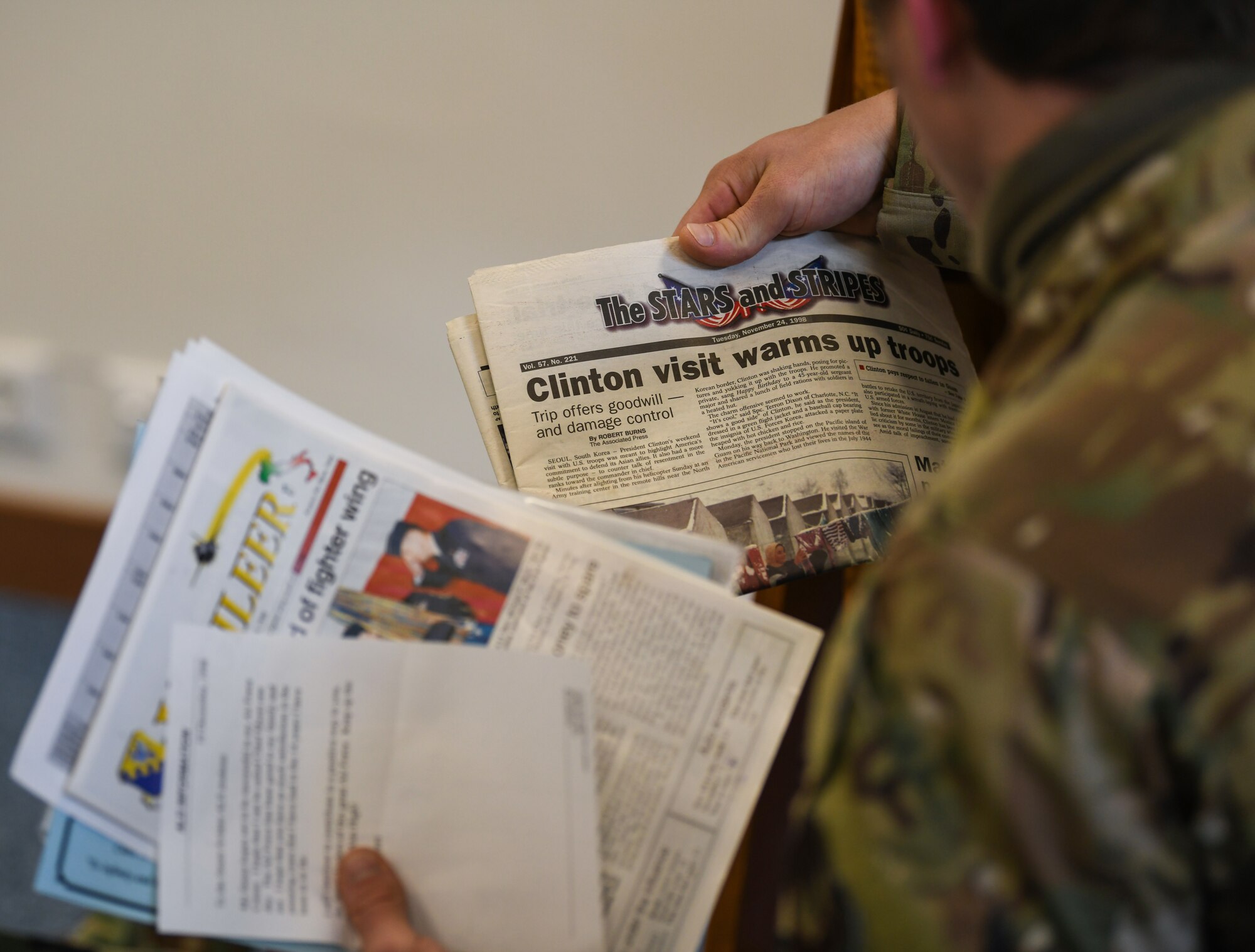 U.S. Air Force Staff Sgt. Michael D. Szydlowski, 57th Rescue Squadron pararescueman, reviews an article from Stars and Stripes dated November 24, 1998 at Aviano Air Base, Italy, May 15, 2020. The capsule was constructed by the class of 99-A Aviano Airman Leadership School. (U.S. Air Force photo by Airman 1st Class Ericka A. Woolever)