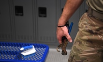 Senior Airman Logan Smith, 628th Civil Engineering Squadron water and fuels systems maintenance specialist, prepares to perform plumbing maintenance on Joint Base Charleston, S.C., May 12, 2020. Water and fuel systems maintenance specialists manage the plumbing, wastewater collection systems, liquid fuel storage and natural gas distribution systems on every base. This maintenance can include the waste systems that keep bases clean and sanitary. Water and fuel system maintainers have kept up operations during the COVID-19 physical distancing posture in order to ensure base cleanliness and the health and wellness of our JB Charleston teammates.