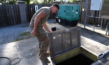 Senior Airman Logan Smith, 628th Civil Engineering Squadron water and fuels systems maintenance specialist, inspects a septic pump system used to ensure waste is properly disposed of on Joint Base Charleston, S.C., May 12, 2020. Water and fuel systems maintenance specialists manage the plumbing, wastewater collection systems, liquid fuel storage and natural gas distribution systems on every base. This maintenance can include the waste systems that keep bases clean and sanitary. Water and fuel system maintainers have kept up operations during the COVID-19 physical distancing posture in order to ensure base cleanliness and the health and wellness of our JB Charleston teammates.