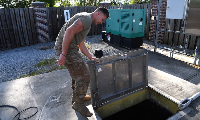 Senior Airman Logan Smith, 628th Civil Engineering Squadron water and fuels systems maintenance specialist, inspects a septic pump system used to ensure waste is properly disposed of on Joint Base Charleston, S.C., May 12, 2020. Water and fuel systems maintenance specialists manage the plumbing, wastewater collection systems, liquid fuel storage and natural gas distribution systems on every base. This maintenance can include the waste systems that keep bases clean and sanitary. Water and fuel system maintainers have kept up operations during the COVID-19 physical distancing posture in order to ensure base cleanliness and the health and wellness of our JB Charleston teammates.