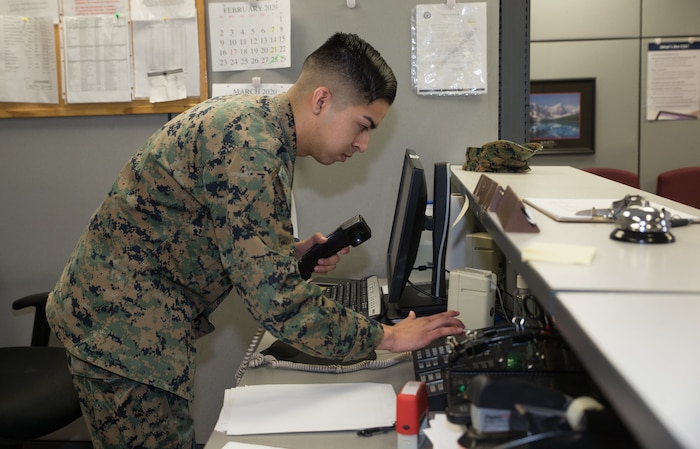 A U.S. Marine assists a customer at Marine Corps Air Station Cherry Point, North Carolina, Feb. 24.