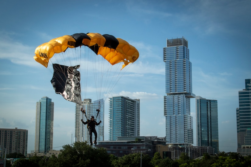 A parachutist lands in a field in Austin, Texas.