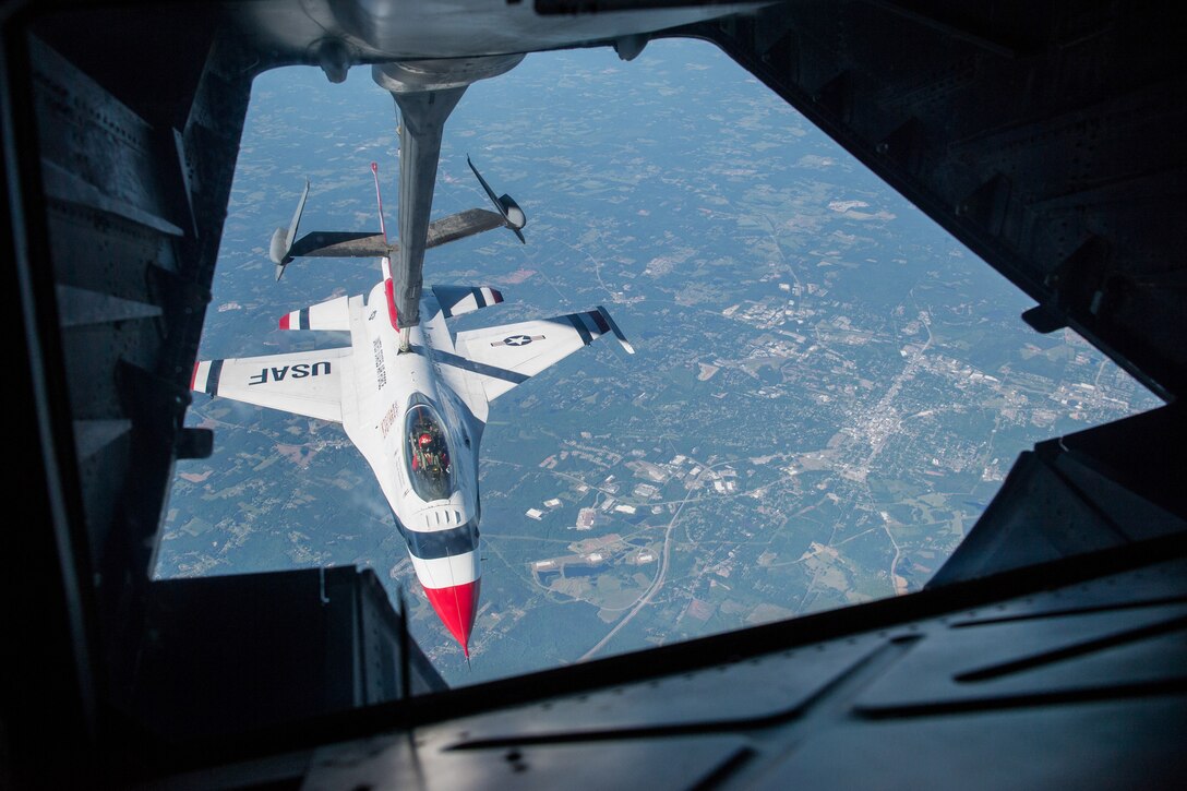 A jet is refueled in midair.