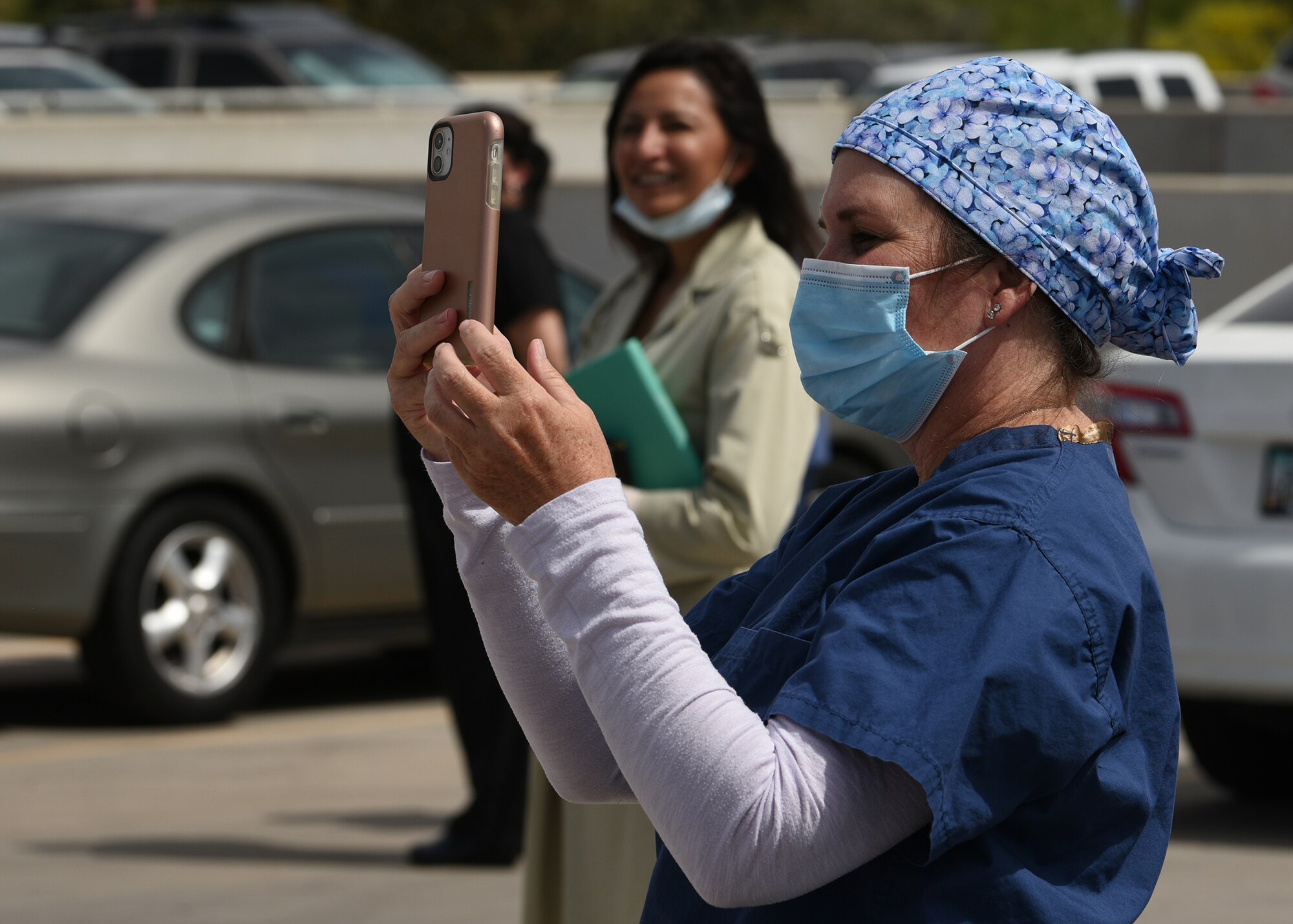 A photo of a nurse recording a flyover.