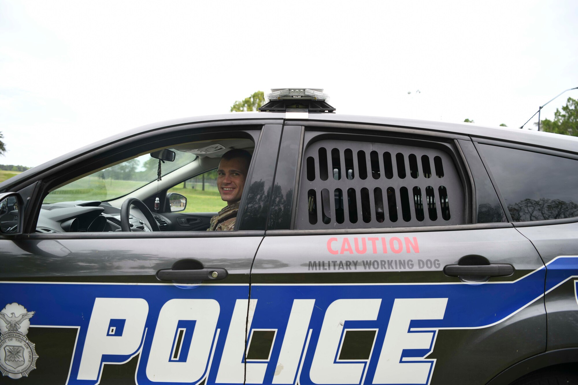 Staff Sgt. Travis Rhoad, 11th Security Support Squadron military working dog handler, prepares to leave for patrol with Cchango, MWD, at Joint Base Andrews, Md., May 14, 2020. Along with patrolling, MWDs can have the capability to detect explosives and drugs. Police Week is held annually during whichever week May 15th falls to honor all law enforcement officers past and present. (U.S. Air Force photo by Airman 1st Class Spencer Slocum)