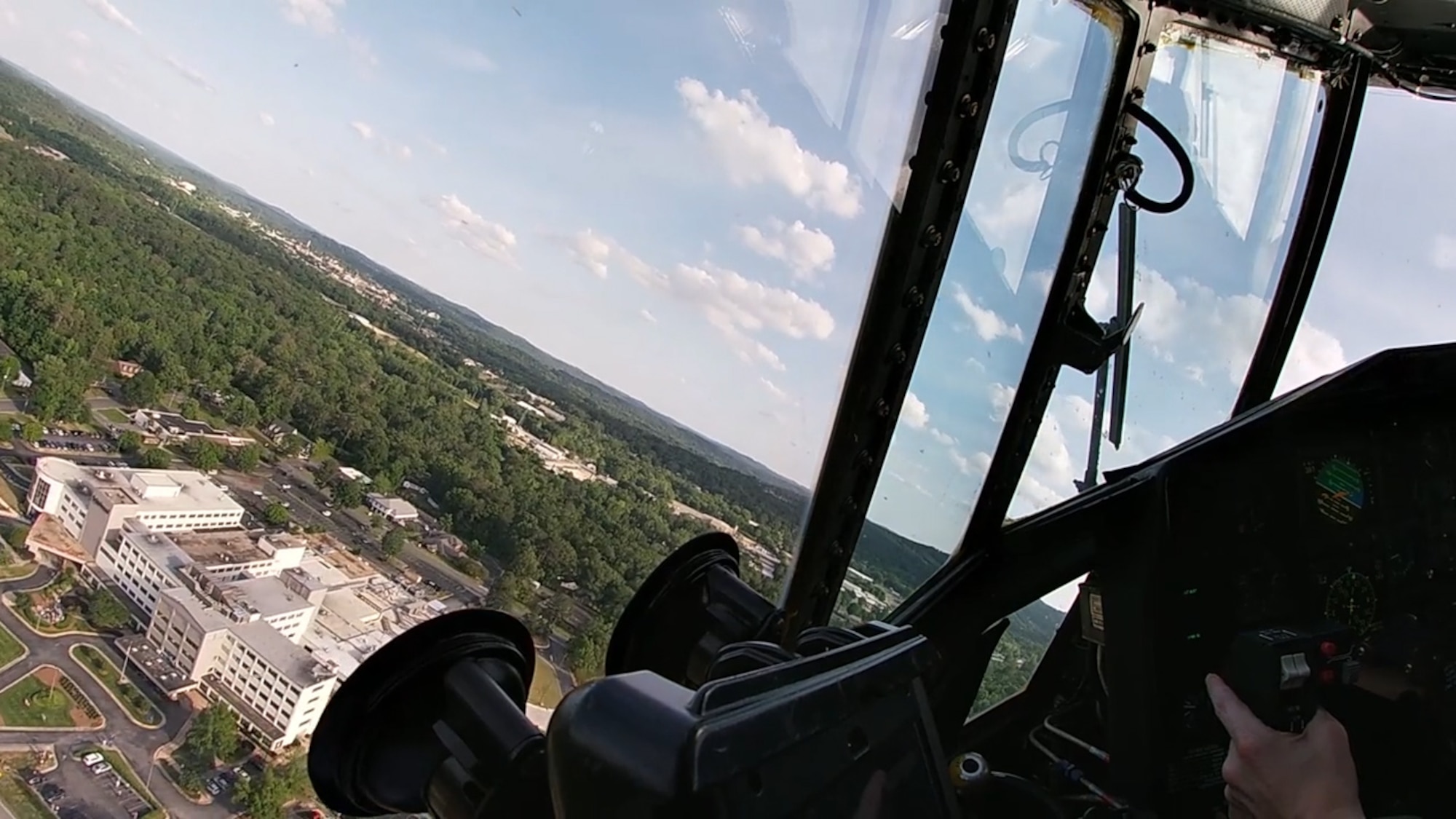A C-130H3 Hercules from Dobbins flies over north Georgia en route to a number of hospitals in the region where it and another C-130 from Dobbins performed a flyover to show appreciation on May 14, 2020. The two C-130s took off from Dobbins around 6 p.m. that day and headed toward hospitals in Kennesaw, Canton, Japer, Dalton, Rome, Cartersville and Hiram. (U.S. Air Force photo/Master Sgt. Michael McGhee)
