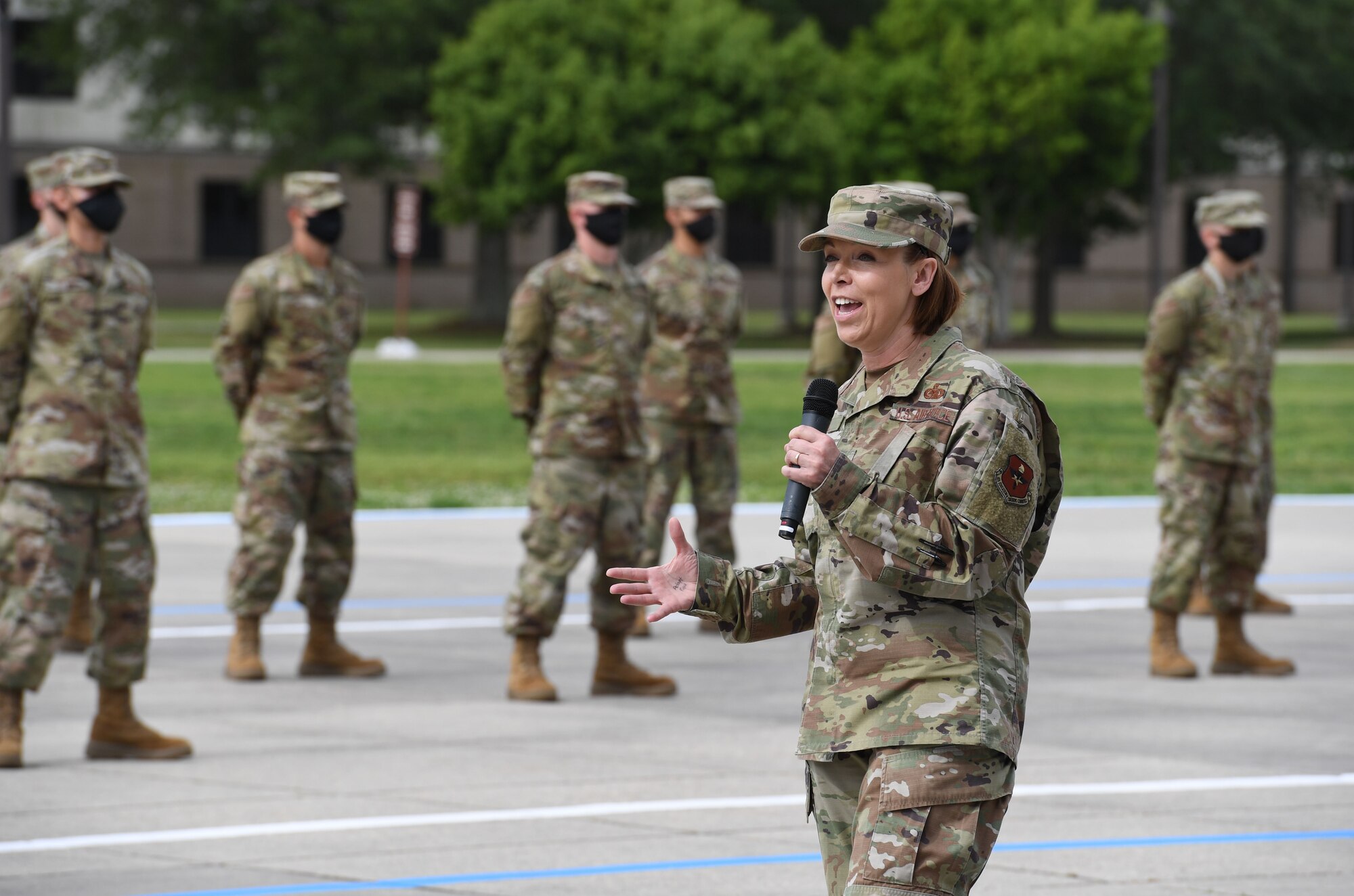 U.S. Air Force Chief Master Sgt. Julie Gudgel, Air Education and Training Command command chief, delivers remarks during the basic military training graduation ceremony at Keesler Air Force Base, Mississippi, May 15, 2020. Nearly 60 Airmen from the 37th Training Wing Detachment 5 completed the six-week basic military training course. Due to safety concerns stemming from COVID-19, the Air Force sent new recruits to Keesler to demonstrate a proof of concept to generate the force at multiple locations during contingencies. The flight was the first to graduate BMT at Keesler since 1968. (U.S. Air Force photo by Kemberly Groue)