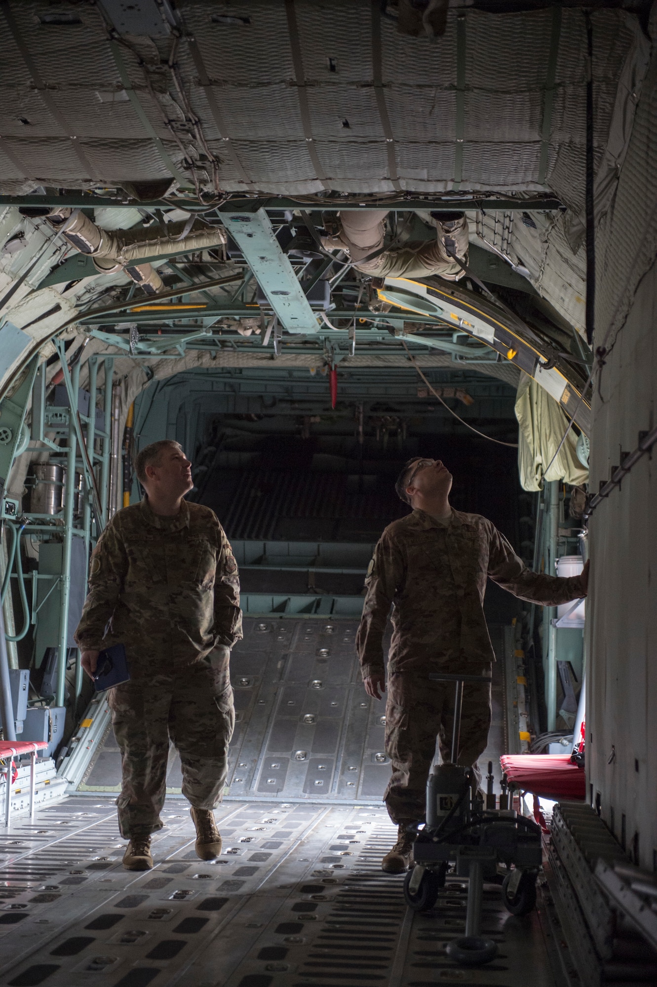 U.S. Air Force Master Sgt. Albert Kirkey, 818th Mobility Support Advisory Squadron team sergeant (left), and Master Sgt. Salvador Mascorro, 818th MSAS aircraft maintenance air advisor (right), look over an Ethiopian C-130 Hercules at Harar Meda Air Base, Ethiopia, Jan. 14, 2020. U.S. Air Force air advisors provided technical expertise to train Ethiopian Air Force aircrew on how to execute a C-130 mission profile to help support peacekeeping operations in the region. (U.S. Air Force photo by Staff Sgt. Sarah Brice)
