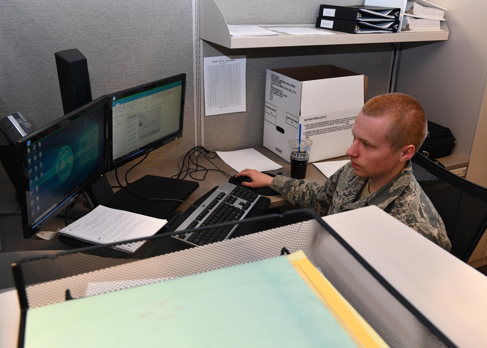 While the 104th Fighter Wing continues to support the COVID-19 response mission, Airmen behind-the-scenes are working hard to take care of their peers and ensure the mission continues to run smoothly.  Airman Jack Proulx is a financial management technician in the comptroller flight at the 104th Fighter Wing. He works part-time in the comptroller office while going to school full-time.  (U.S Air National Guard Photos by Master Sgt. Lindsey Sarah Watson-Kirwin)