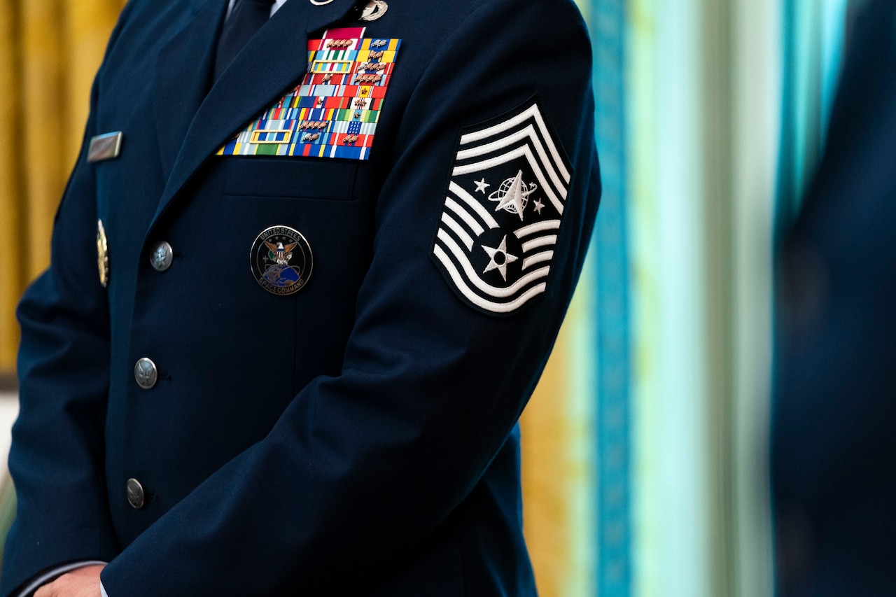 A Space Force rank patch with two stars, five rockers and three chevrons, indicating the wearer is the Space Force’s senior enlisted advisor.