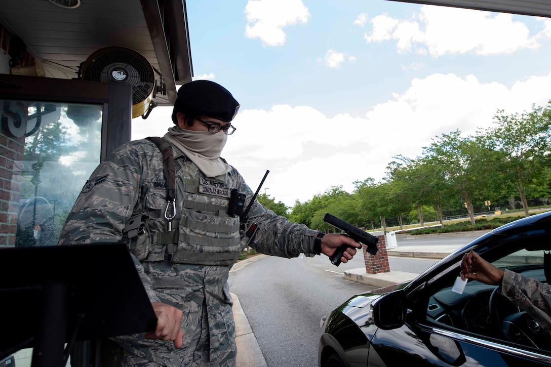 Photo of an Airman scanning an ID.
