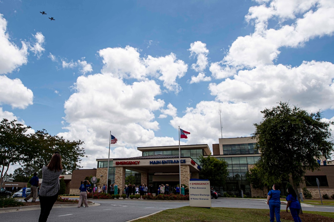 Photo of healthcare professionals watching a flyover.