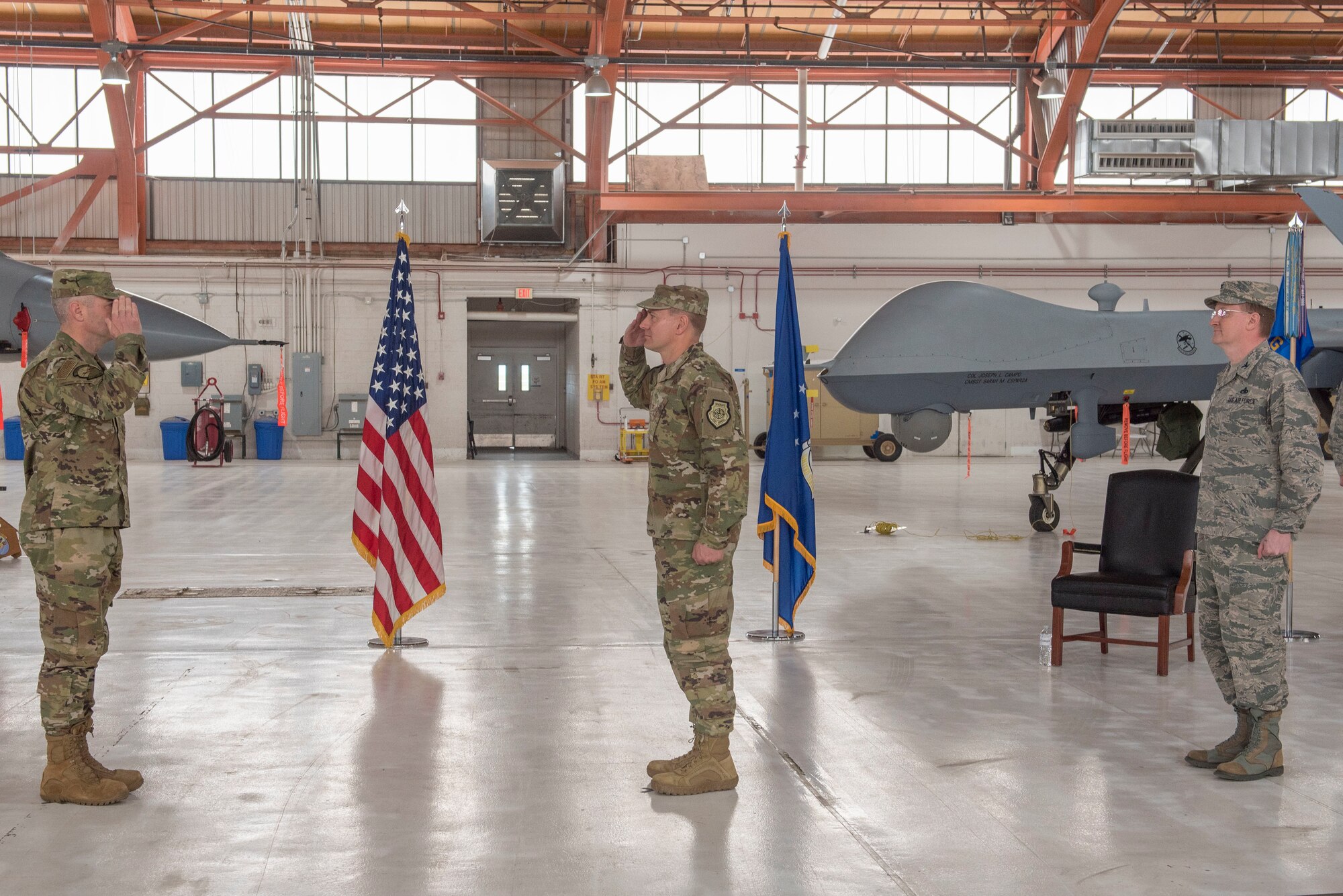 (Center) Col. Thomas Preston, incoming 49th Maintenance Group commander, renders a salute to Col. Joseph Campo, 49th Wing commander, as he assumes command of the 49th MXG, May 15, 2020, on Holloman Air Force Base, N.M. Preston was previously assigned to the U.S. European Command J4 as the operational logistics division chief in Stuttgart, Germany. (U.S. Air Force photo by Staff Sgt. Christine Groening)