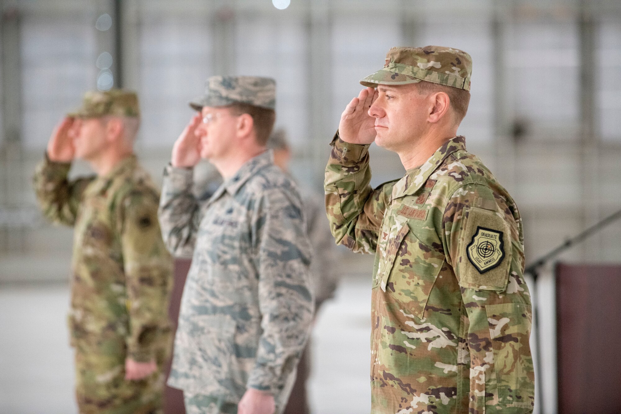 (From right to left) Col. Thomas Preston, incoming 49th Maintenance Group commander; Col. Tim Harbor, outgoing 49th MXG commander and Col. Joseph Campo, 49th Wing commander, render salutes during the 49th MXG Change of Command ceremony, May 15, 2020, on Holloman Air Force Base, N.M. The 49th MXG consists of a team of over 2,100 Airmen, civilians and contractors from 23 specialties to produce disciplined maintenance and sortie-generation capabilities on F-16 Vipers, MQ-9 Reapers and their associated cockpits. (U.S. Air Force photo by Staff Sgt. Christine Groening)