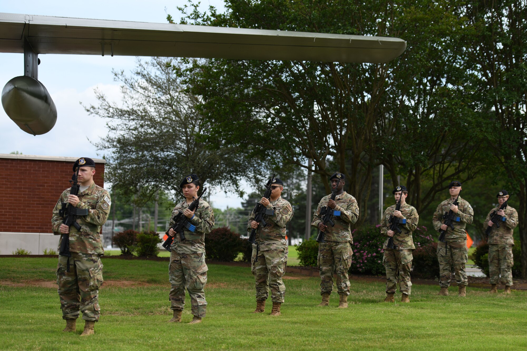 Airmen rendering a 21 gun salute.