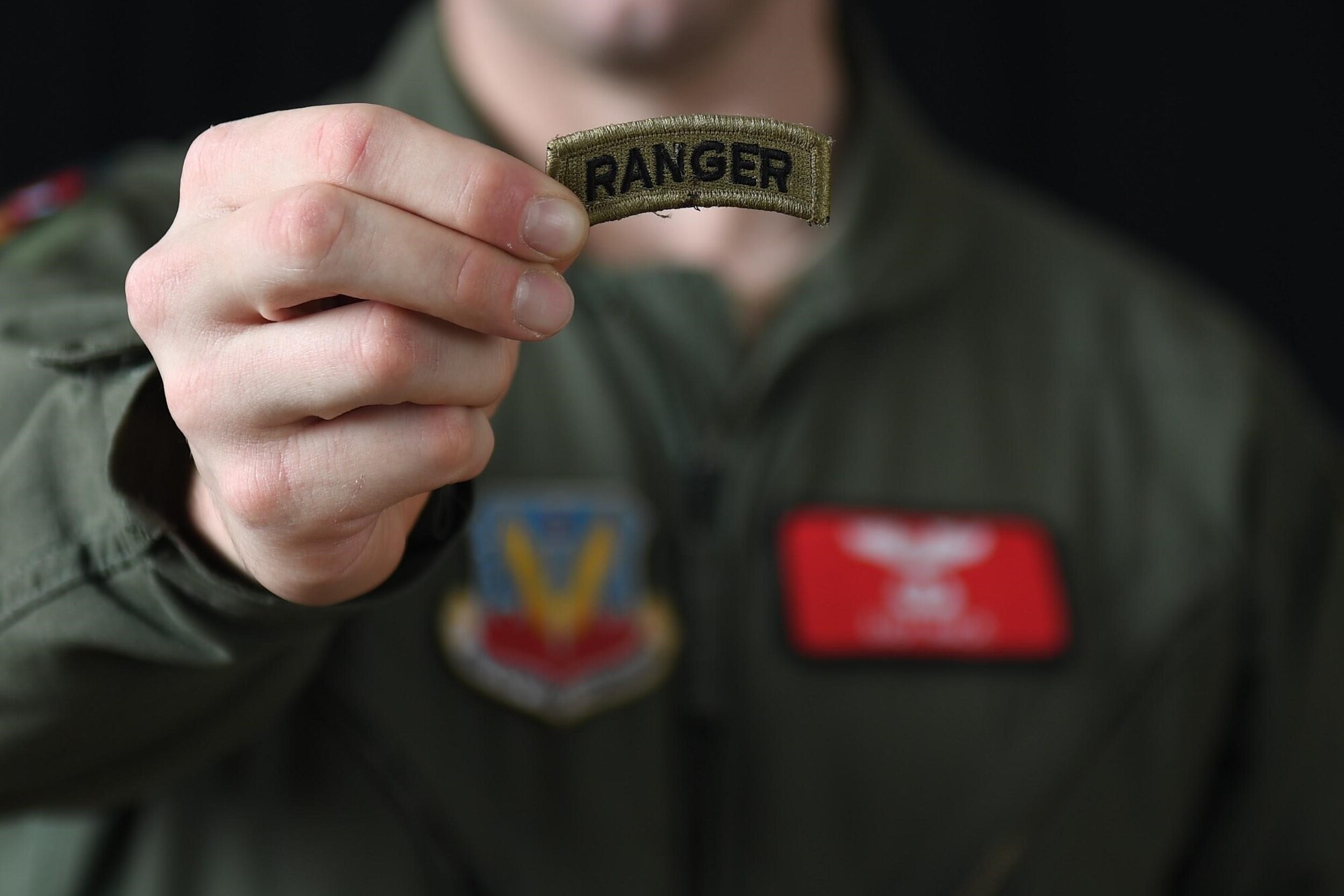 MQ-9 Reaper pilot holds up Ranger tab to camera