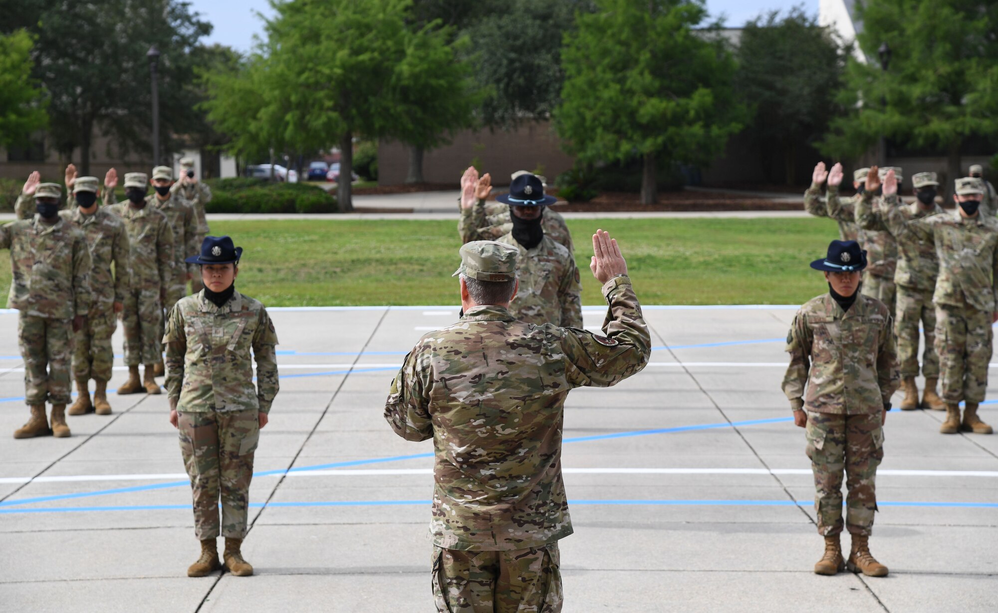 U.S. Air Force Lt. Gen. Brad Webb, commander of Air Education and Training Command, delivers the Oath of Enlistment during the basic military training graduation ceremony at Keesler Air Force Base, Mississippi, May 15, 2020. Nearly 60 Airmen from the 37th Training Wing Detachment 5 completed the six-week basic military training course. Due to safety concerns stemming from COVID-19, the Air Force sent new recruits to Keesler to demonstrate a proof of concept to generate the force at multiple locations during contingencies. The flight was the first to graduate BMT at Keesler since 1968. (U.S. Air Force photo by Kemberly Groue)