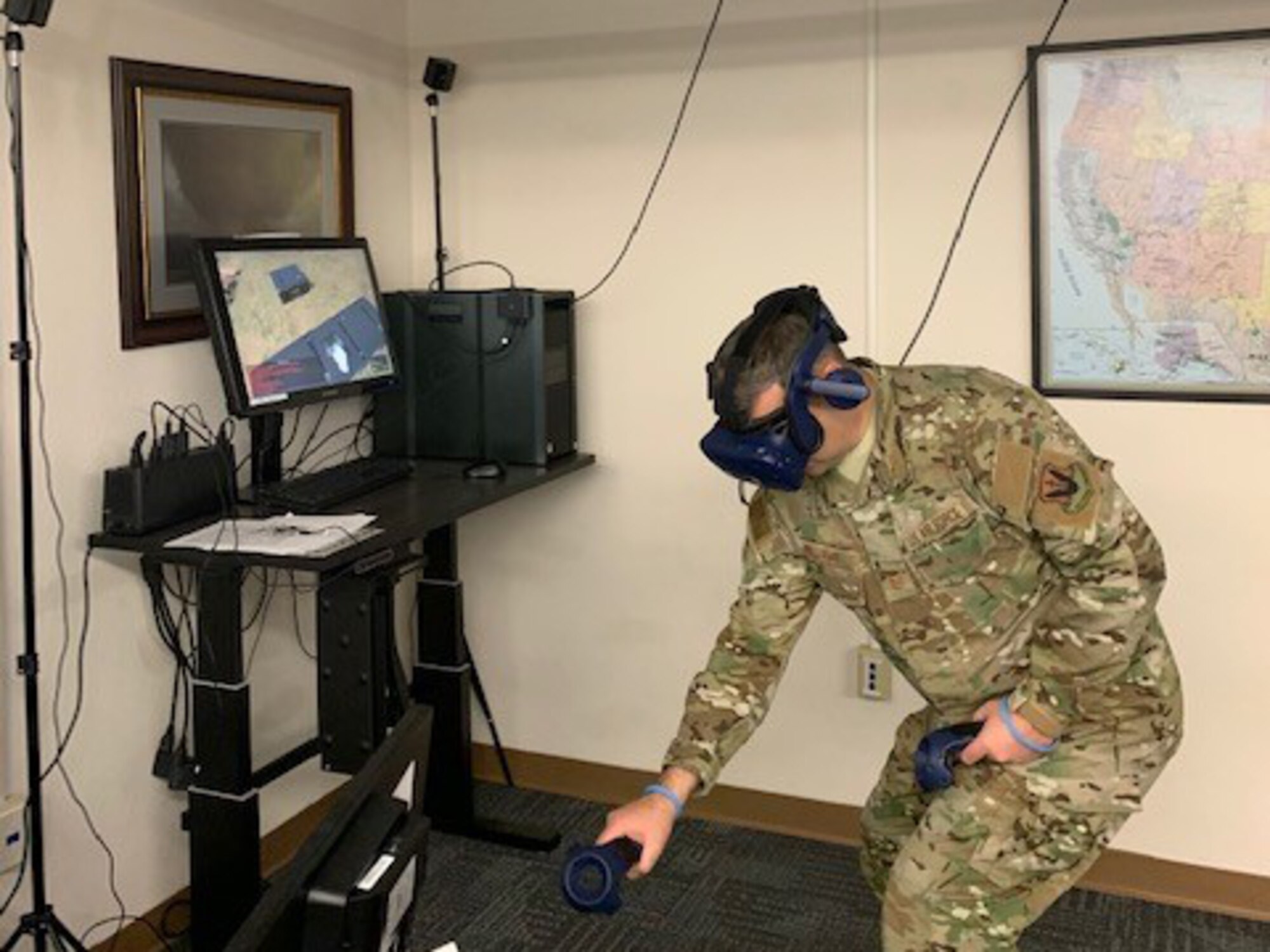 Airman using virtual reality equipment for training.
