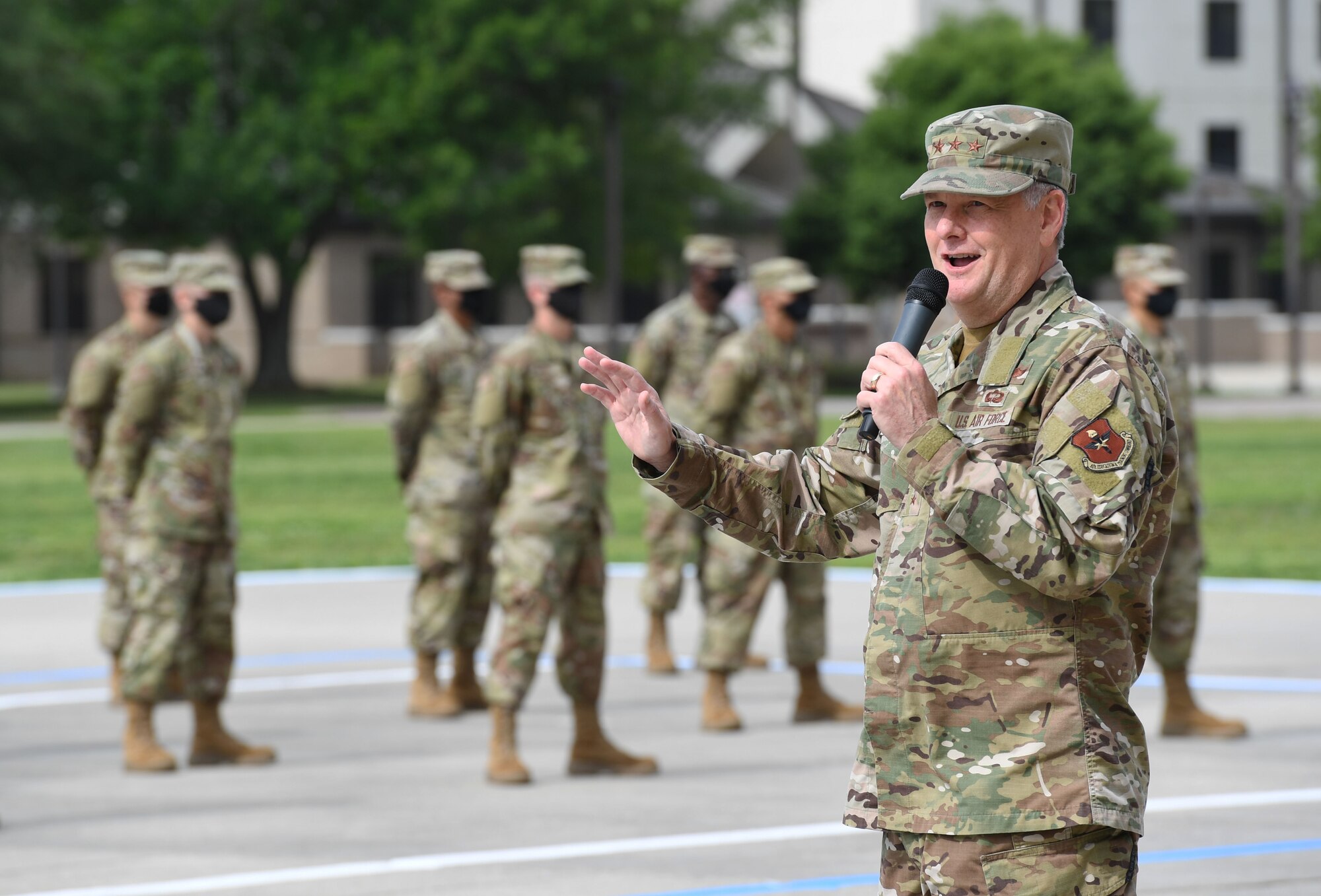 U.S. Air Force Lt. Gen. Brad Webb, commander of Air Education and Training Command, delivers remarks during the basic military training graduation ceremony at Keesler Air Force Base, Mississippi, May 15, 2020. Nearly 60 Airmen from the 37th Training Wing Detachment 5 completed the six-week basic military training course. Due to safety concerns stemming from COVID-19, the Air Force sent new recruits to Keesler to demonstrate a proof of concept to generate the force at multiple locations during contingencies. The flight was the first to graduate BMT at Keesler since 1968. (U.S. Air Force photo by Kemberly Groue)