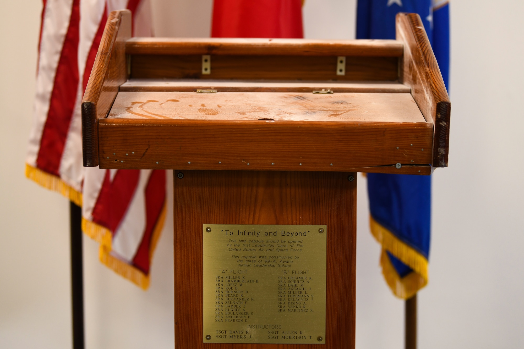 A time capsule is displayed during a virtual Airman Leadership School graduation at Aviano Air Base, Italy, May 15, 2020. The capsule was constructed by the class of 99-A Aviano Airman Leadership School and it was requested to be opened by the first leadership school class of the United States Air and Space Force. (U.S. Air Force photo by Airman 1st Class Ericka A. Woolever)