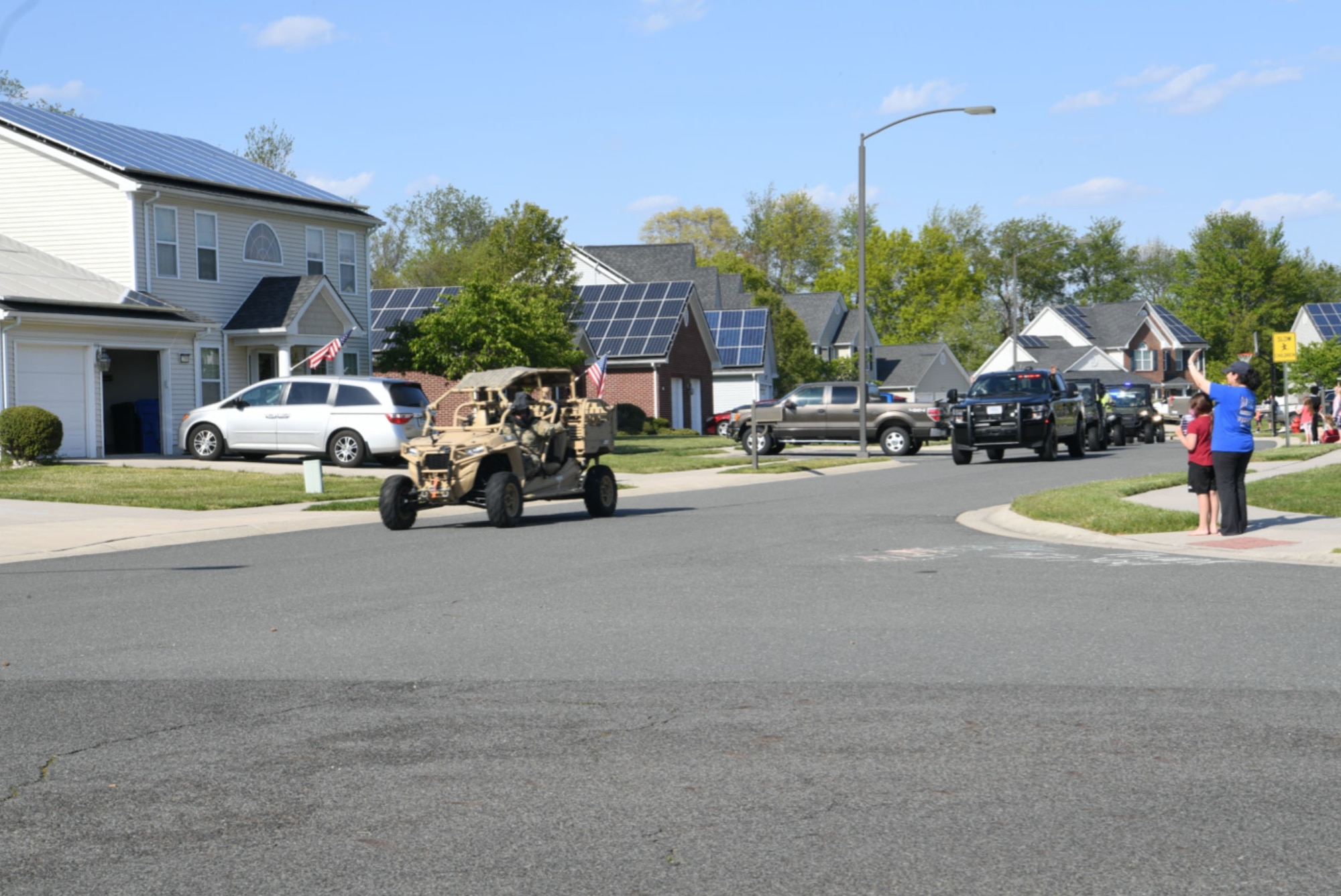 Tech. Sgt. Lance Oakes, 321st Contingency Response Squadron, operates an MRZR vehicle during the Cops For Kids Parade at Joint Base McGuire-Dix-Lakehurst, N.J., May 13, 2020. National Police Week is held in honor of law enforcement officers around the world. (U.S. Air Force photo by Tech. Sgt. Luther Mitchell)