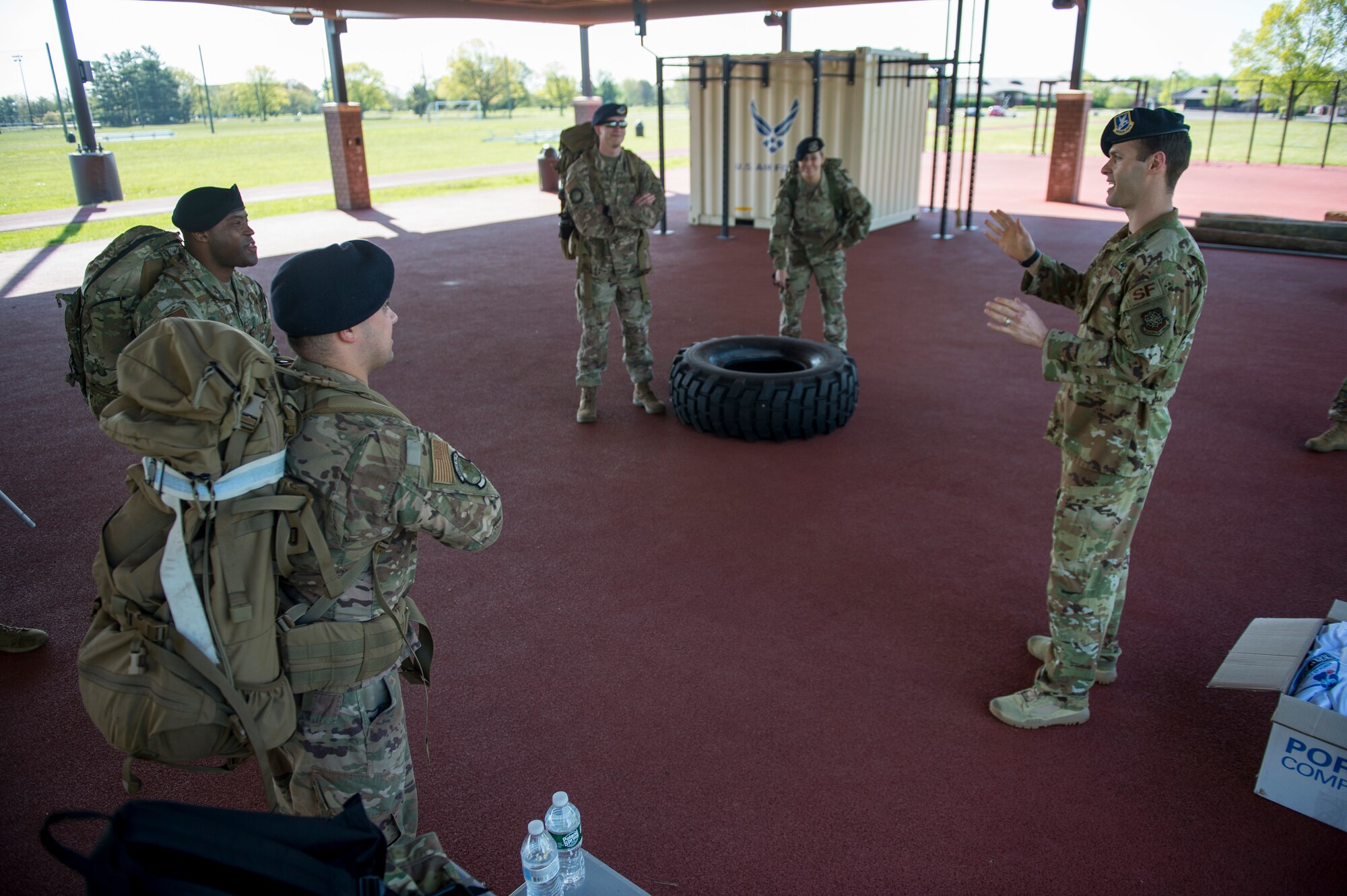 Security Forces Airmen receive a briefing prior to the start of a 24-hour ruck march May 15, 2020 at Joint Base McGuire-Dix-Lakehurst, N.J. The ruck march is an annual event that takes place during police week to remember fallen defenders. (U.S. Air Force photo by Staff Sgt. Sarah Brice)