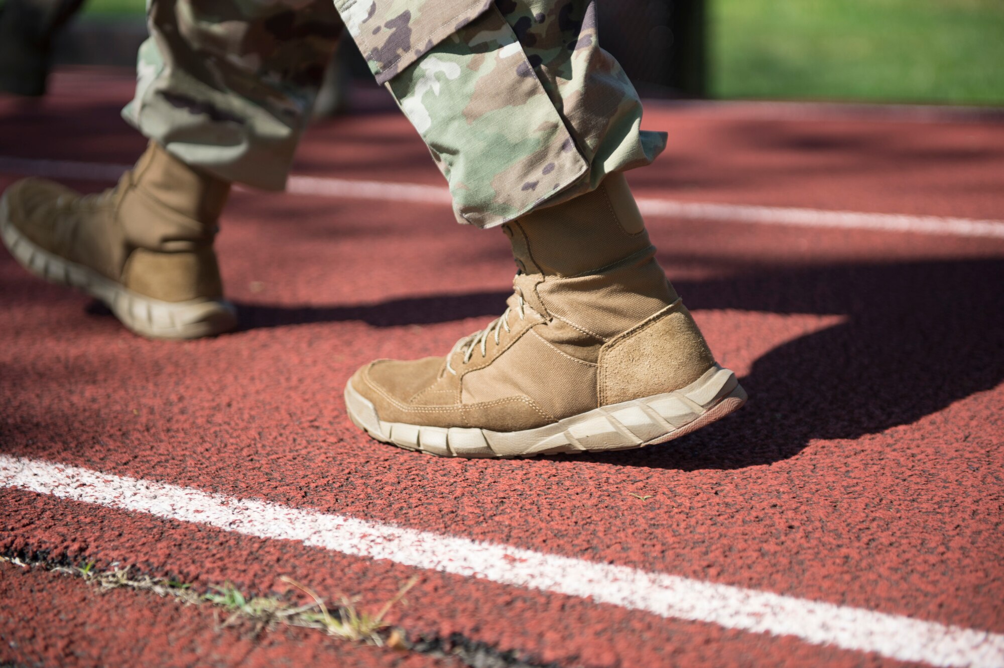 Security Forces Airmen march around a fitness track as they take part in a 24-hour ruck march to honor fallen defenders May 15, 2020 at Joint Base McGuire-Dix-Lakehurst, N.J. Airmen volunteer to take shifts and keep the march going until 9 a.m. EST the next day. (U.S. Air Force photo by Staff Sgt. Sarah Brice)