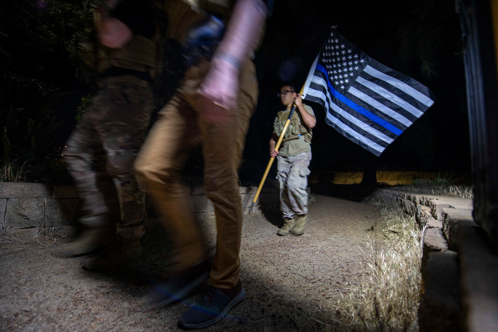 Photo of service members marching.