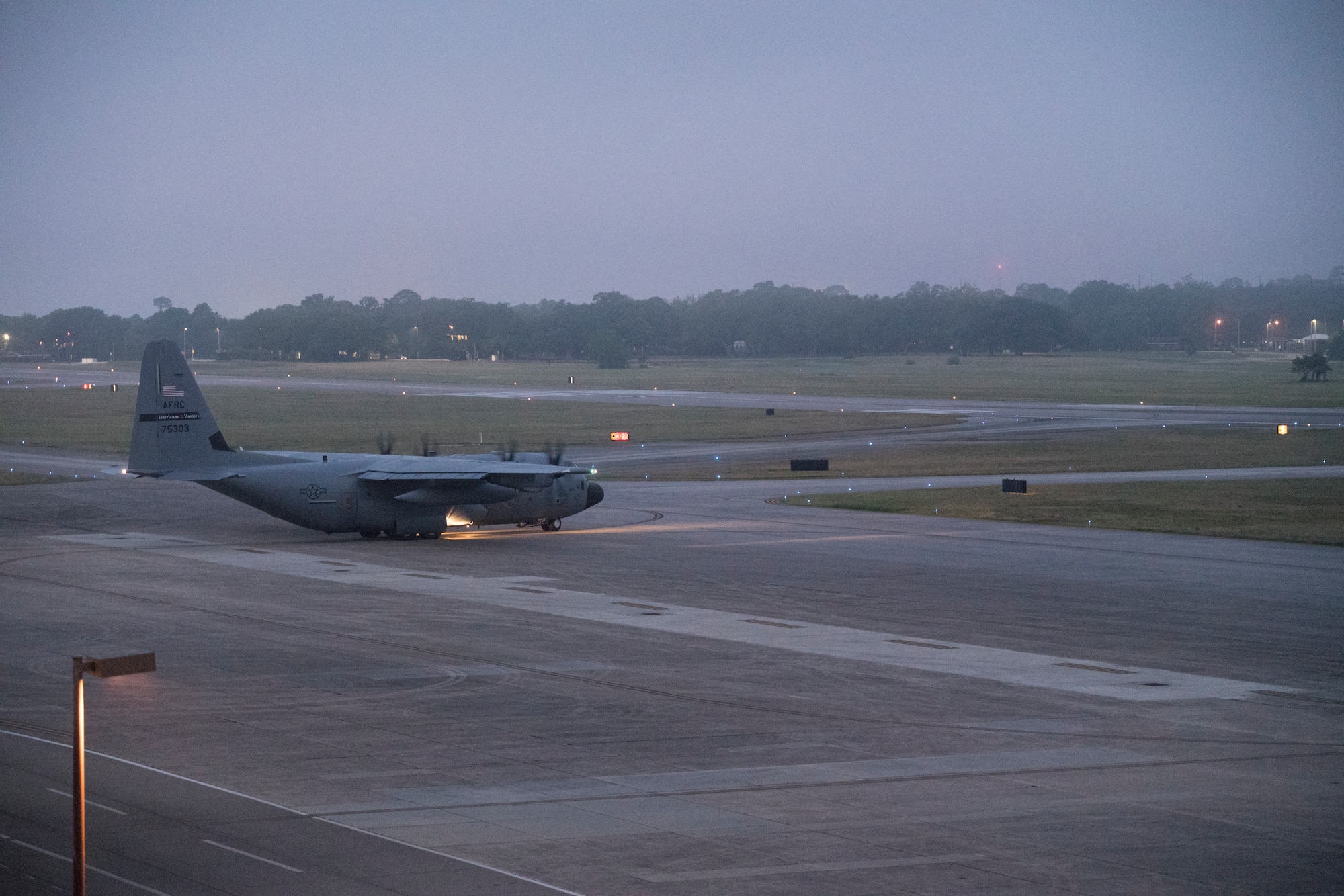 A WC-130J Super Hercules aircraft from 53rd Weather Reconnaissance Squadron taxis to the runway May 16, at Keesler Air Force Base, Miss. The Hurricane Hunters departed today on their first storm tasking of the 2020 Atlantic hurricane season to investigate an area for possible development into a tropical depression or storm near the Bahamas. (U.S. Air Force photo by Tech. Sgt. Christopher Carranza)