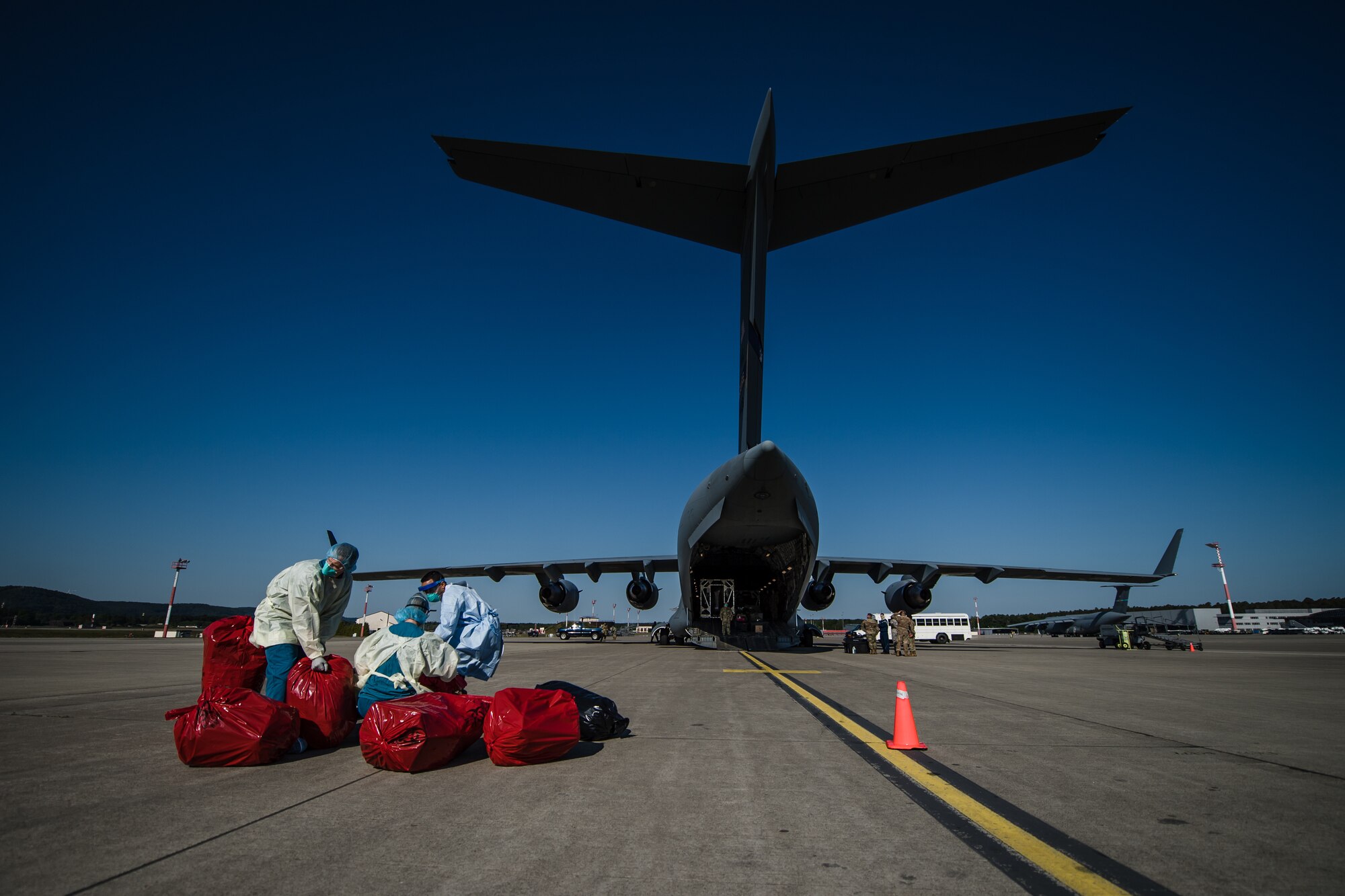 U.S. Airmen assigned to the 313th Expeditionary Operations Support Squadron sort through patients’ belongings at Ramstein Air Base, Germany, May 16, 2020.