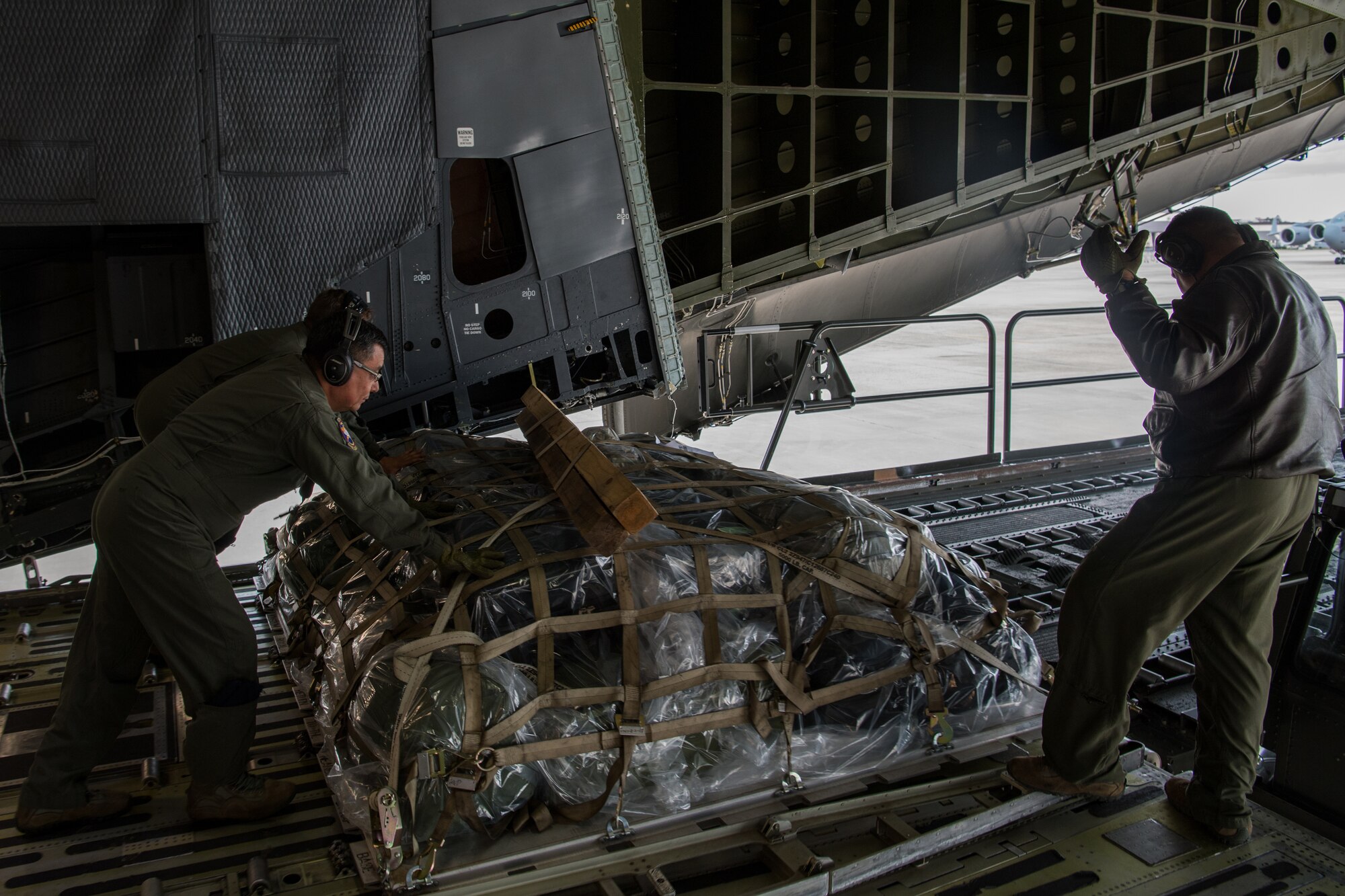 U.S. Reserve Citizen Airmen with the 433rd Airlift Wing’s 68th Airlift Squadron, offload cargo belonging to medical personnel who are supporting the residents of New York City in the fight against COVID-19, at Joint Base McGuire-Dix-Lakehurst, N.J., April 5, 2020.