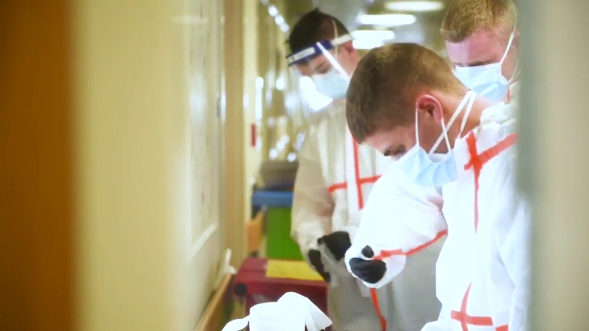 Soldiers and Airmen from the Massachusetts National Guard prepare to decon after caring for residents with COVID-19 at Hathaway Manor Extended Care, New Bedford, Mass., May 7, 2020.