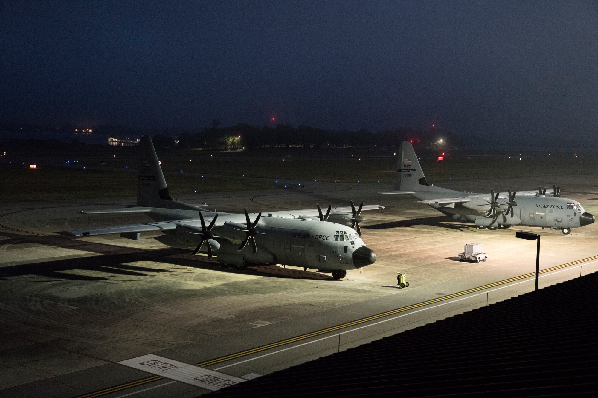 WC-130J Super Hercules aircraft from the 53rd Weather Reconnaissance Squadron sit on the flightline May 16, at Keesler Air Force Base, Miss. The Hurricane Hunters departed today on their first storm tasking of the 2020 Atlantic hurricane season to investigate an area for possible development into a tropical depression or storm near the Bahamas. (U.S. Air Force photo by Tech. Sgt. Christopher Carranza)