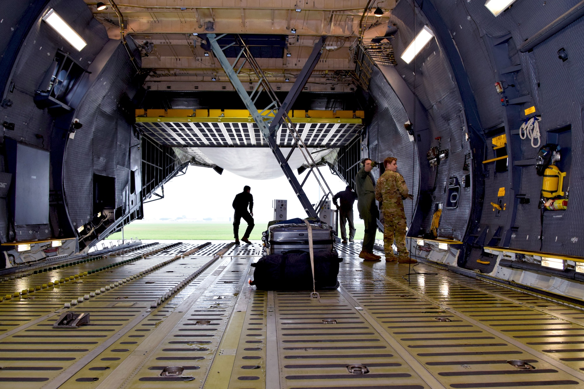 Aircrew members in the 433rd Airlift Wing prepare a C-5M Super Galaxy aircraft at Joint Base San Antonio-Lackland, Texas, for a flight to carry a team of medical technicians mobilized to respond to the COVID-19 crisis April 5, 2020.