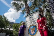April Cheesebourough and Christina Schenk, VA employees and Air Force spouses, await a flyover saluting healthcare workers in the fight against COVID-19, May 15, 2020, at Ralph H. Johnson VA Medical Center in Charleston, South Carolina. Joint Base Charleston Airmen from the 315th Airlift Wing and 437th Airlift Wing, came together to train during this salute to healthcare workers that flew over several Charleston medical centers.